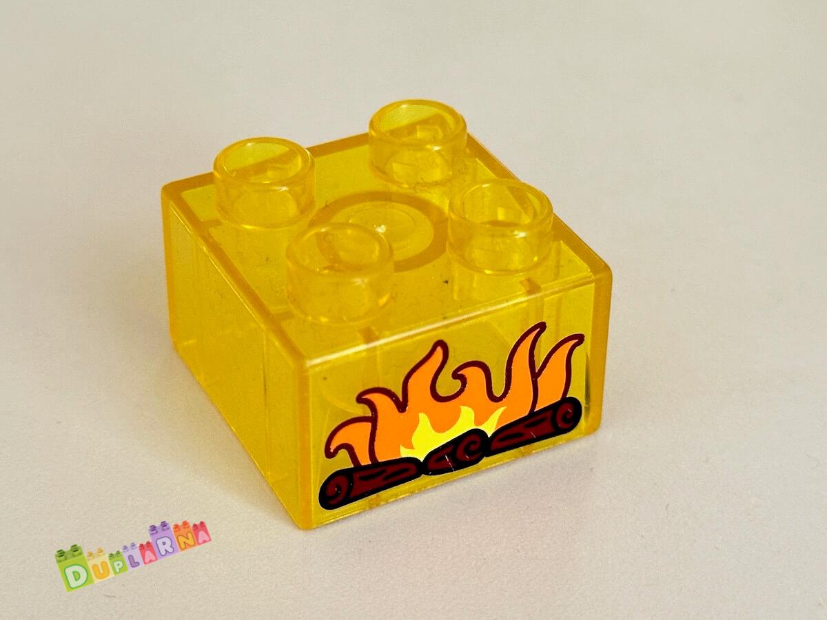 Lego Duplo - Kostka průhledná žlutá s potiskem krbu 2x2